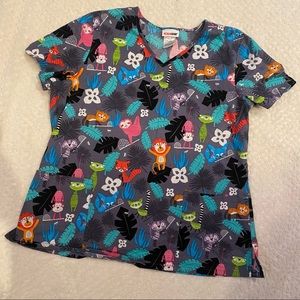 Brightly colored jungle animal scrub top